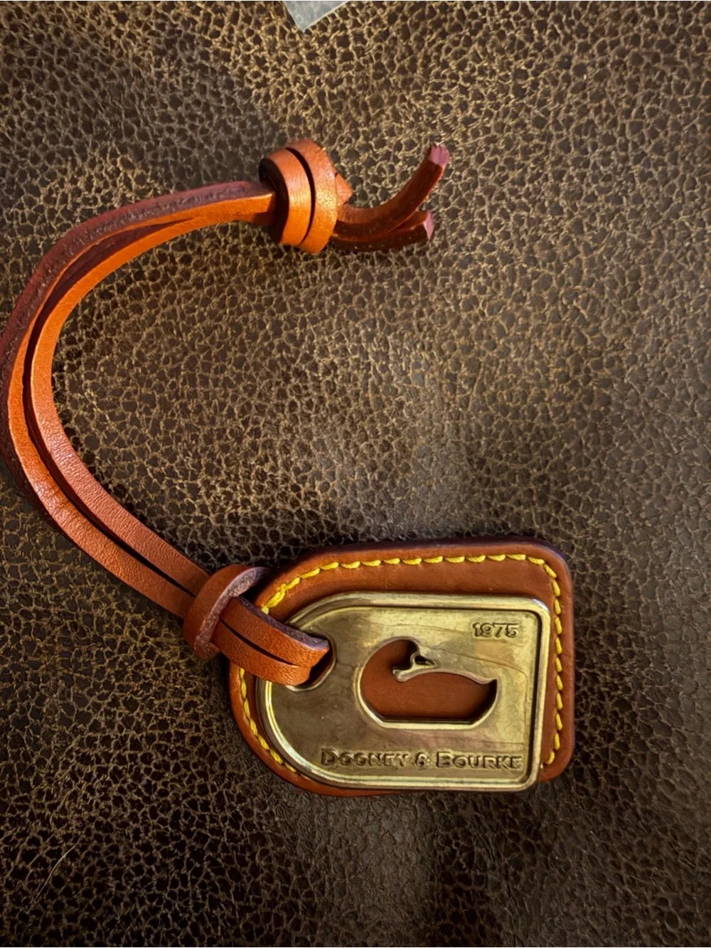 Dooney & Bourke Tan Leather Duck logo Brass Plate hangtag